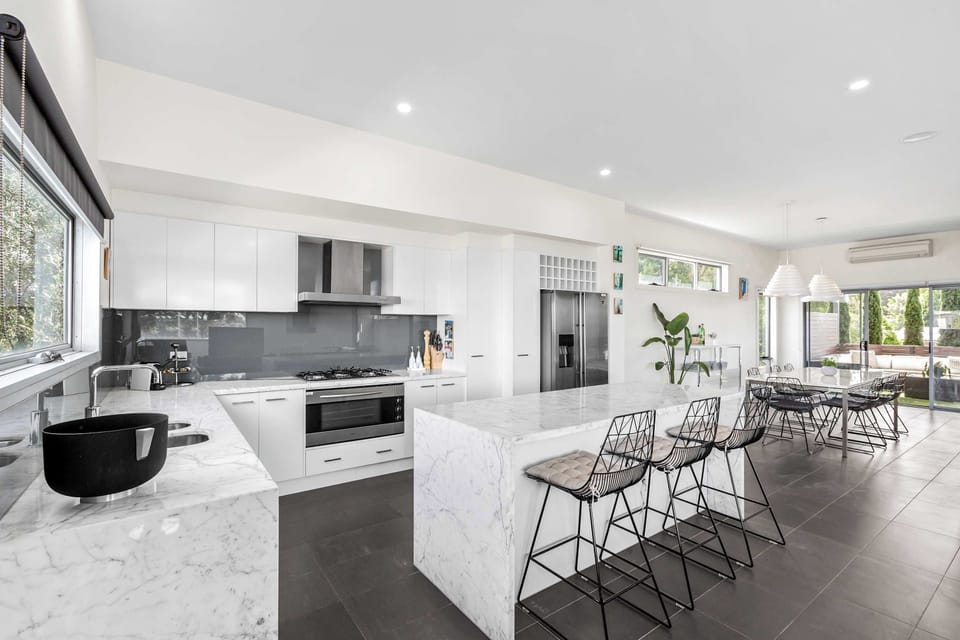 Beautifully renovated throughout, this home exudes a sleek, contemporary charm that guests will love
