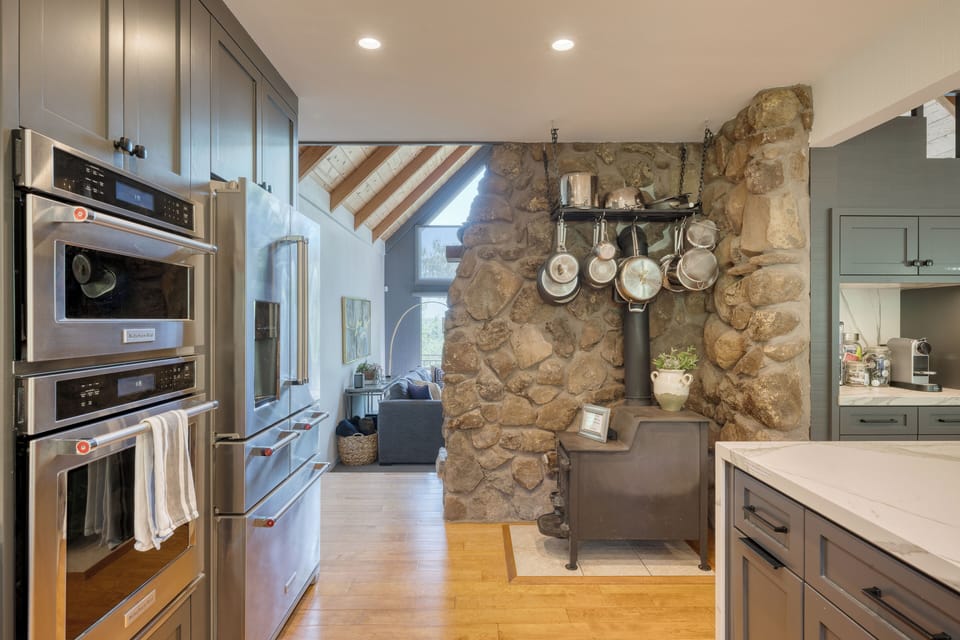 Traditional wood stove adds charm.