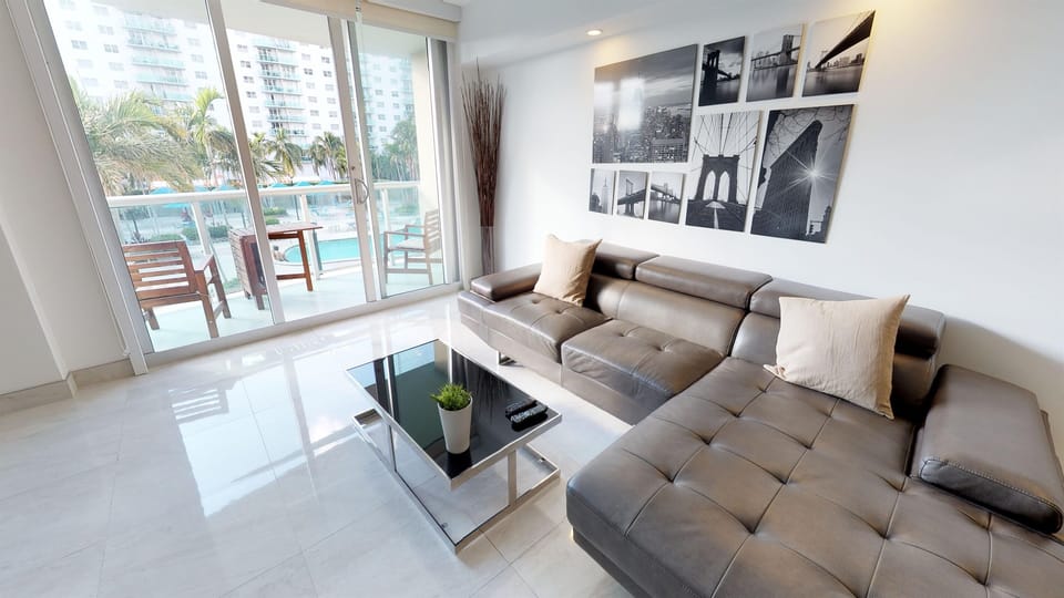 Living Room with Balcony access - Balcony has Pool View 