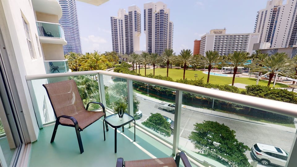 Balcony with Park view! Just steps to the beach! 