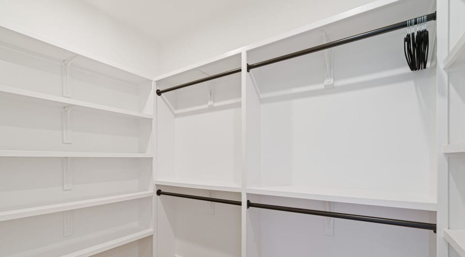 Your wardrobe`s new best friend: A spacious walk-in closet with ample shelving and hanging space to keep your belongings neatly organized during your stay.