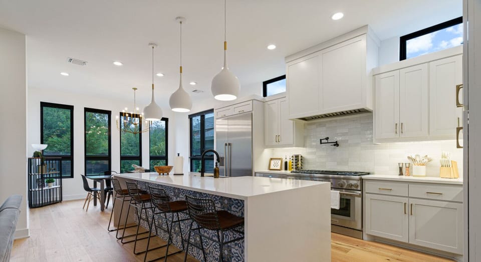 An open-concept kitchen and dining area designed for seamless flow, perfect for cooking, dining, and connecting with ease.