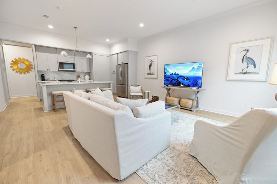 Enjoy the open-concept living and kitchen area, designed for seamless flow and a spacious, inviting atmosphere perfect for family gatherings and entertaining. Gulf Coast vacation home