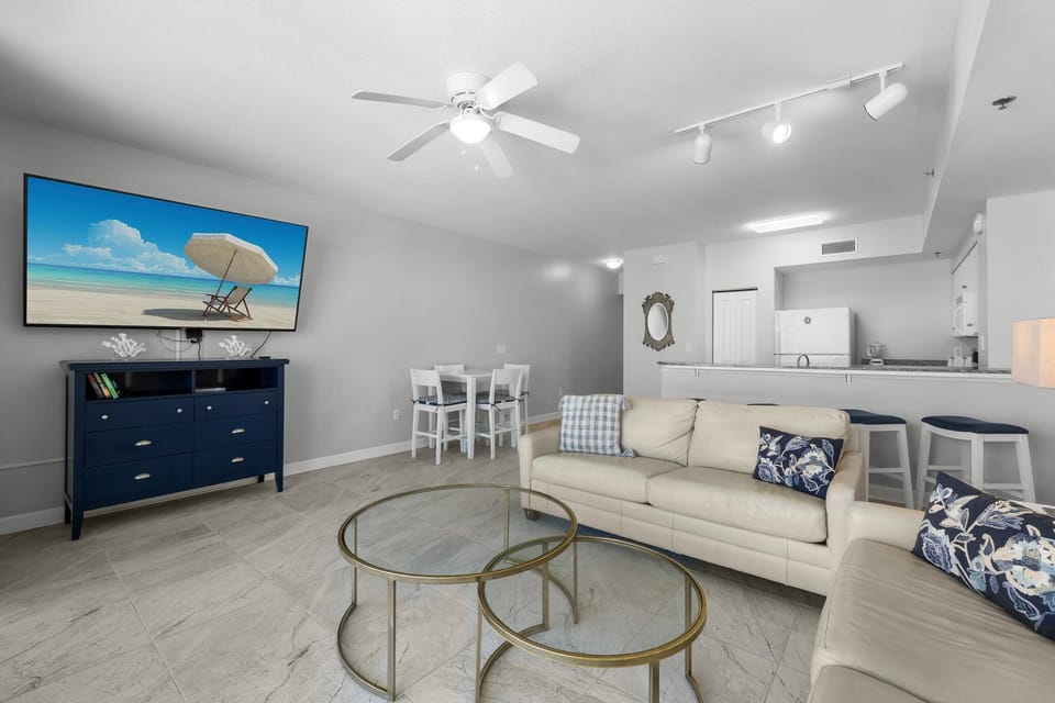 Modern living area with comfortable seating and a dining space adjacent to the kitchen.