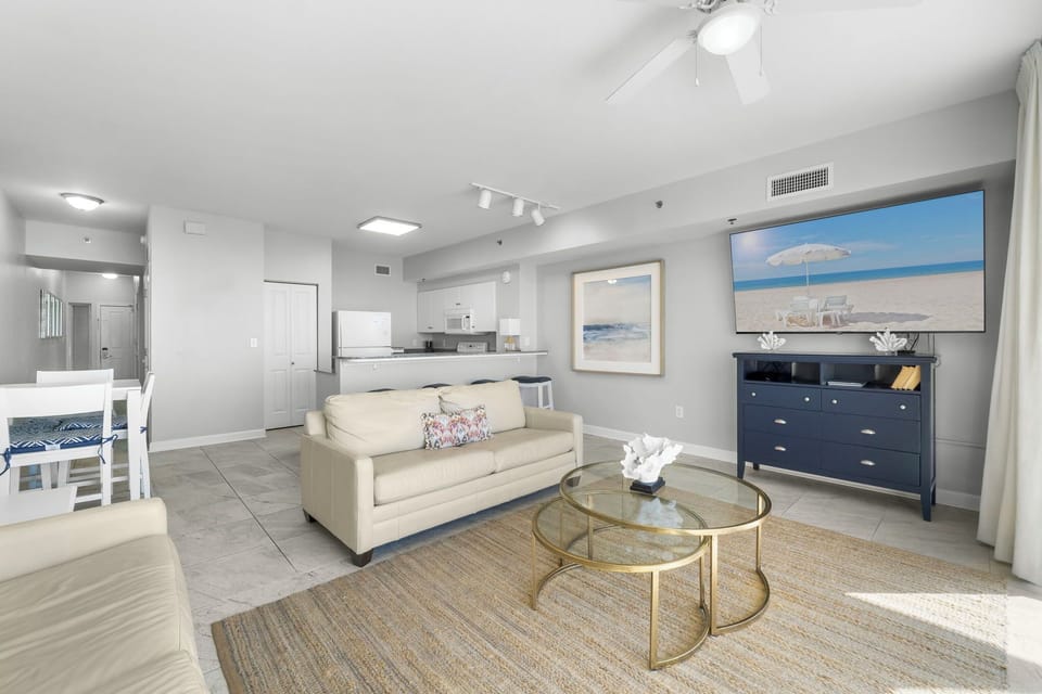 Bright living area with modern furnishings and an open kitchen layout.