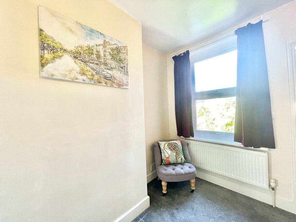 Ensuite bedroom with seating area. 