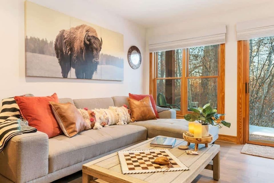 Enjoy the warm & cozy decor and large windows in the living room.