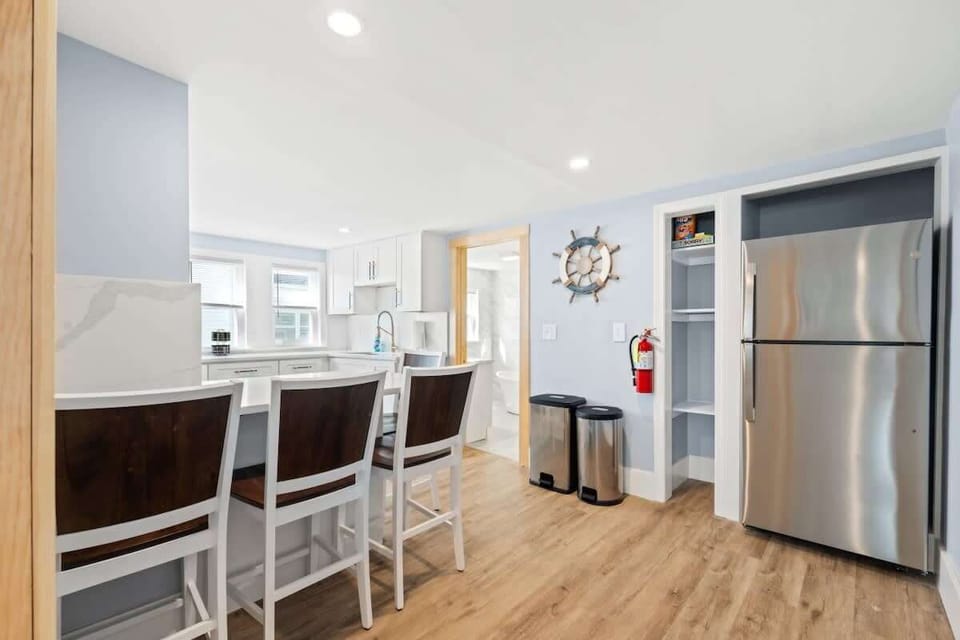 This airy kitchen features an open layout and island seating, making it the ideal spot for meals or conversation.