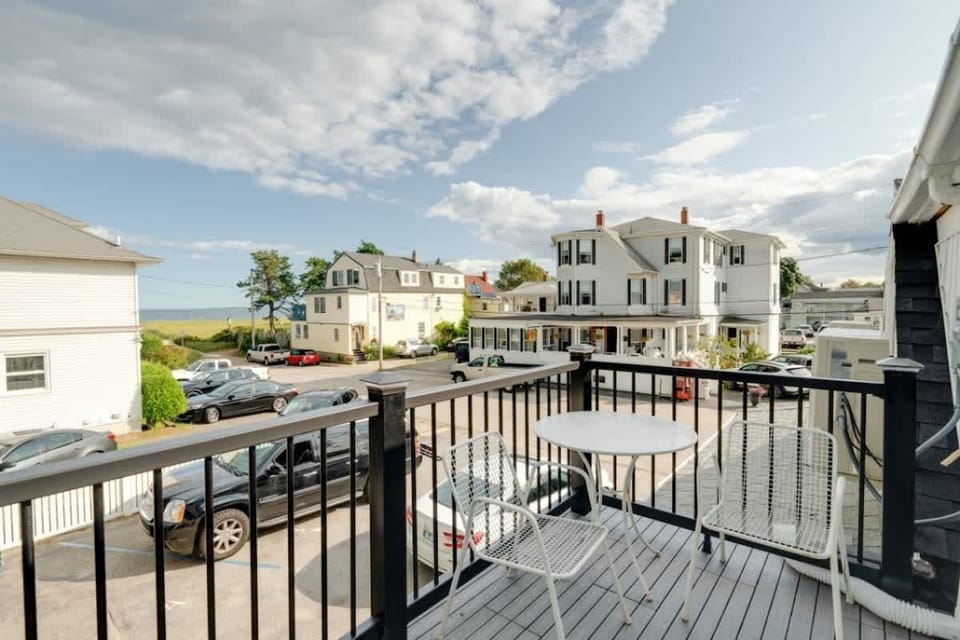Enjoy outdoor dining on the porch with stunning beach views, the perfect spot to relax and soak in the seaside atmosphere.