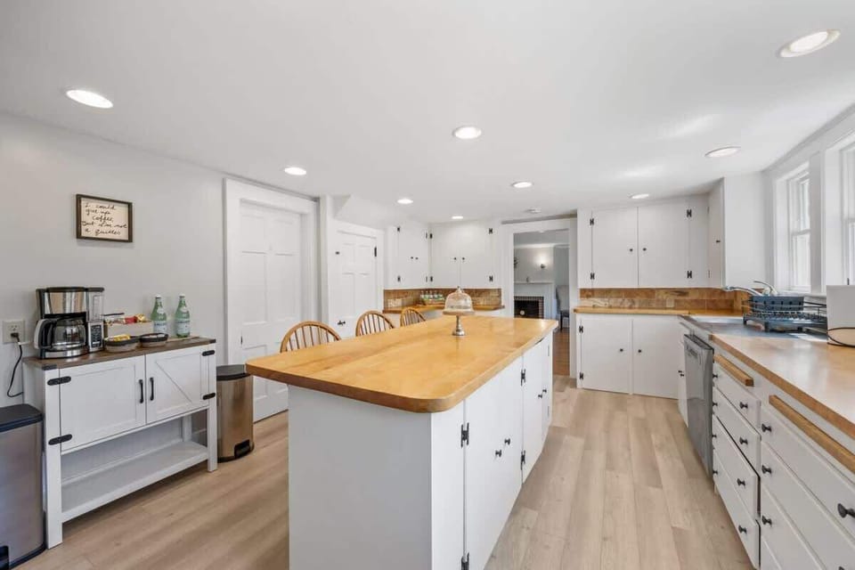 The large kitchen island provides additional prep space and seating, perfect for casual dining or morning coffee.