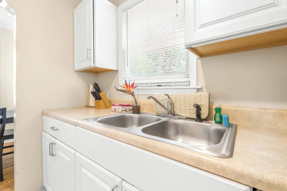 The charming kitchen offers ample storage space & every home comfort