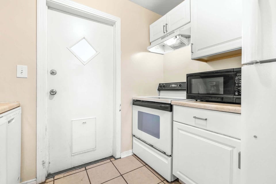The charming kitchen offers ample storage space & every home comfort