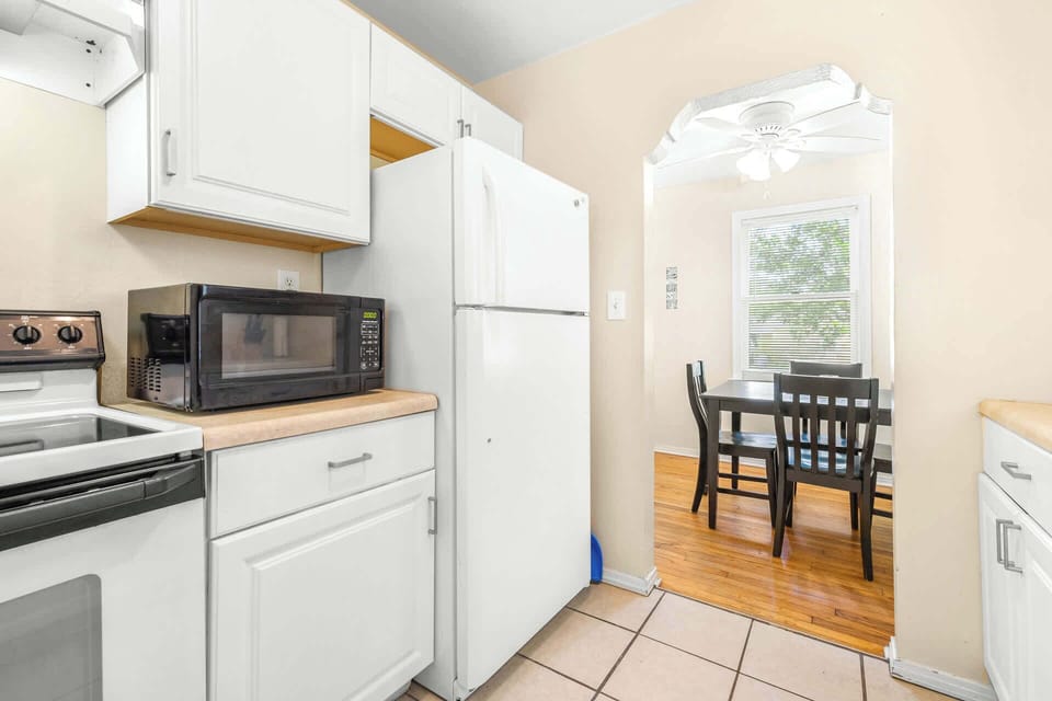 The charming kitchen offers ample storage space & every home comfort