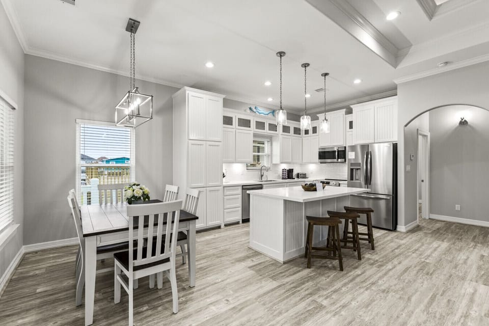 Bright kitchen with modern appliances and cozy dining space.