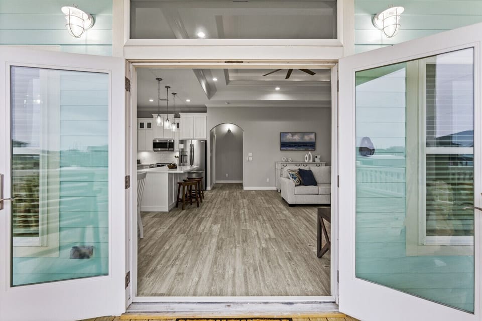 Inviting entry to open living, dining, and kitchen areas