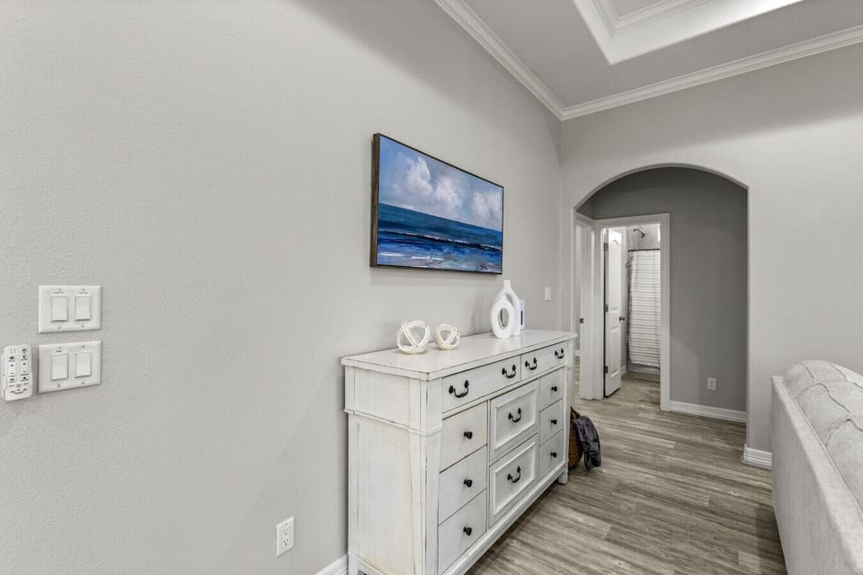 Coastal-inspired decor with charming furniture and ocean artwork.