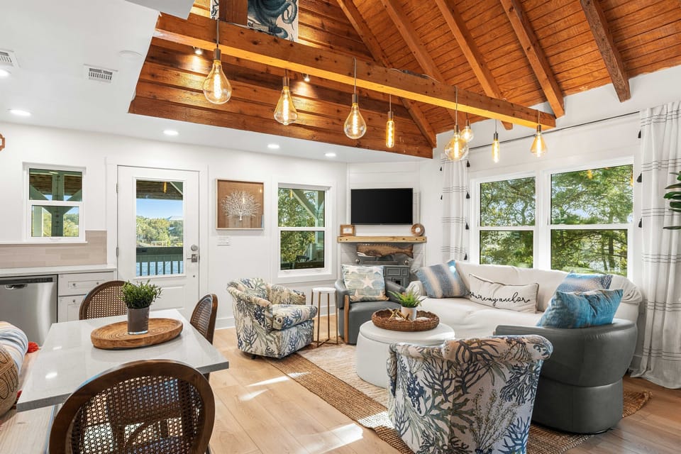 A gathering space with ample seating.  A comfortable sofa to sink into for an afternoon nap.  Or swivel chairs to facilitate conversations between the kitchen and the living space.