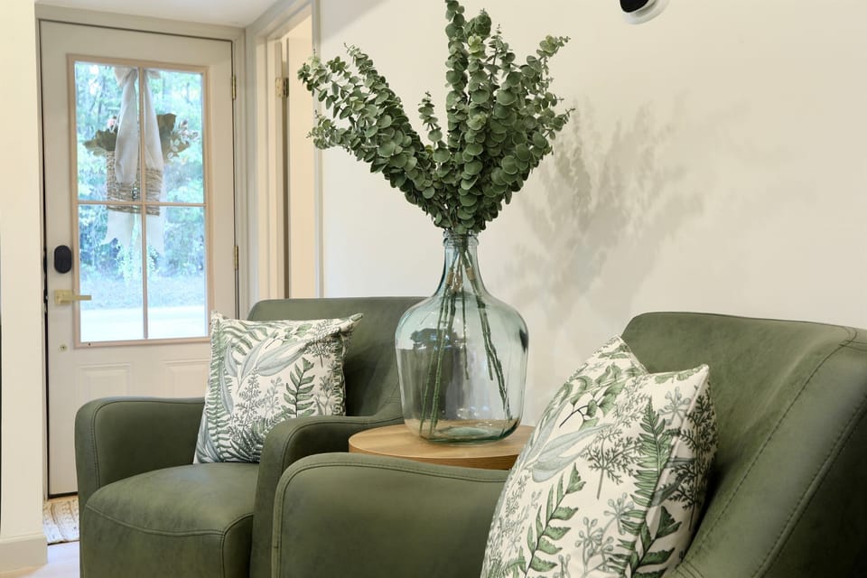 Sink into the luxurious leather sofa or get cozy in one of the swivel chairs.
