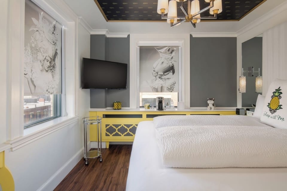 Wake up to bright city light in a stylish room.
