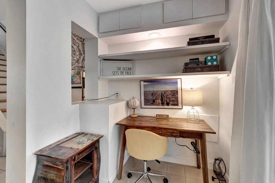 Cozy workspace with a desk and comfortable chair, ideal for remote work.