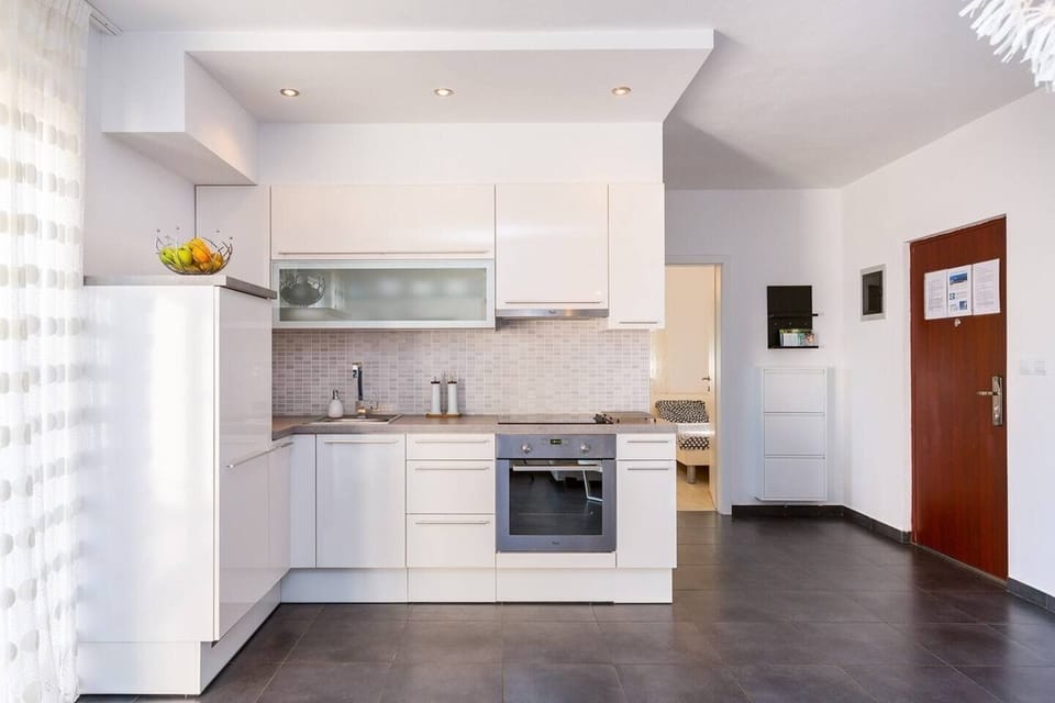 Fully equipped kitchen with oven, stove, and all essentials for home cooking.