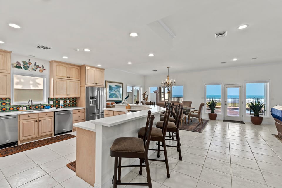 Large open-concept fully stocked Kitchen! Extra countertop seats available