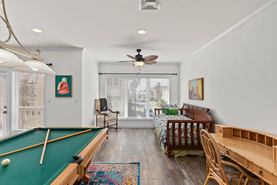 Pool Table and twin day beds featured in the 2nd floor living/game area