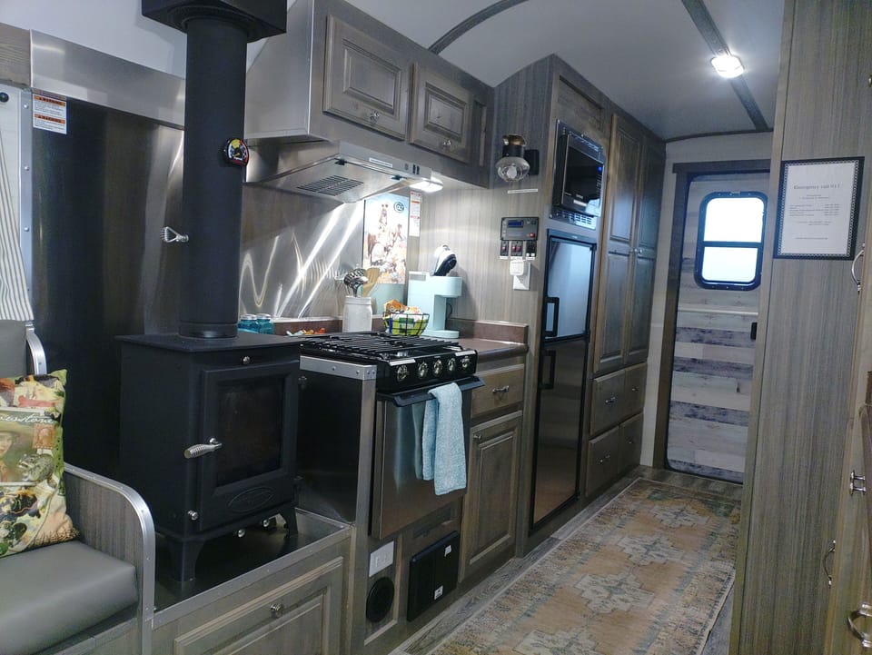 Wood stove, kitchen, closets and drawers, entry door in that order. 
