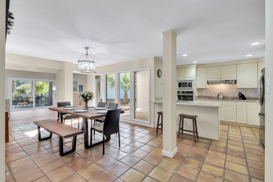 Inside, unwind in the welcoming living and dining areas, prepare meals in the fully equipped kitchen, and retreat to 4 private bedrooms.