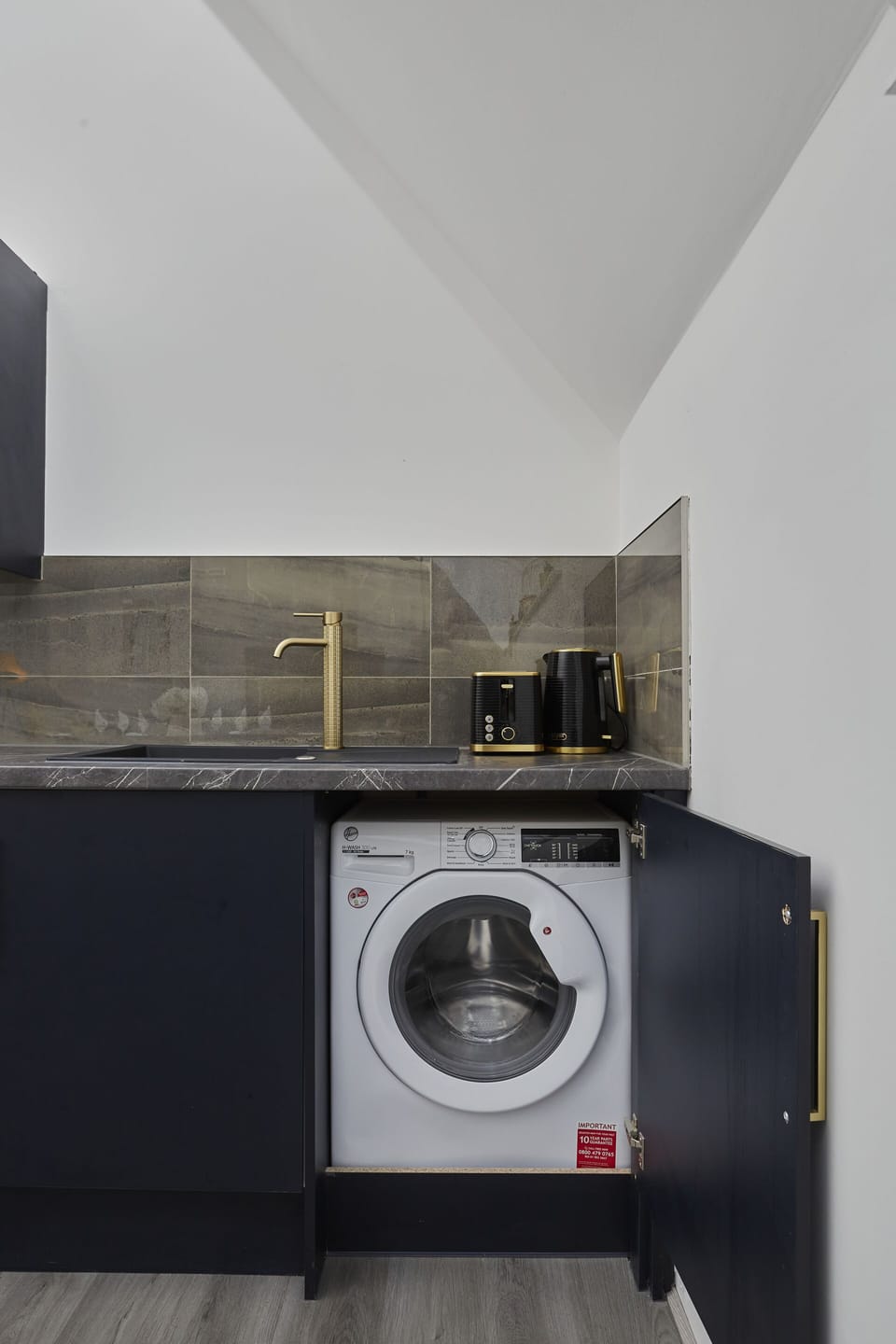 Convenient laundry area with washing facilities for longer stays.