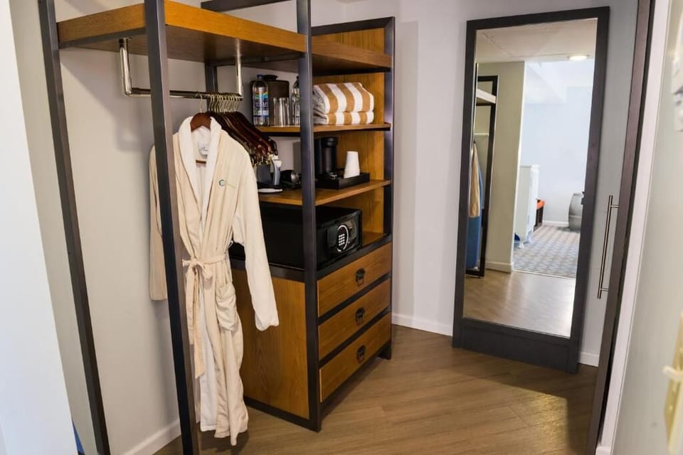 Settle in easily with open storage, robe, and in-room safe.