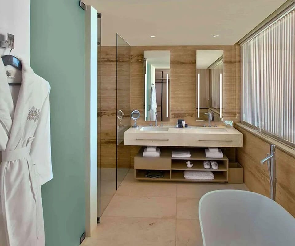 Refresh in a spa-like bath with warm wood finishes.