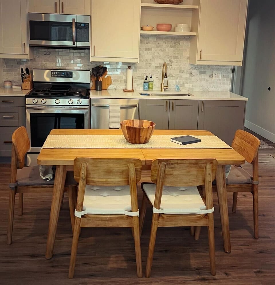 Dining Table expands at the center to seat 8