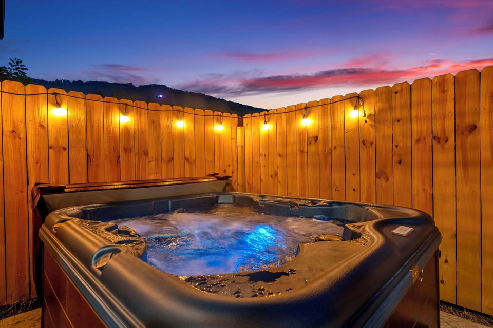 Relaxing outdoor hot tub surrounded by nature.
