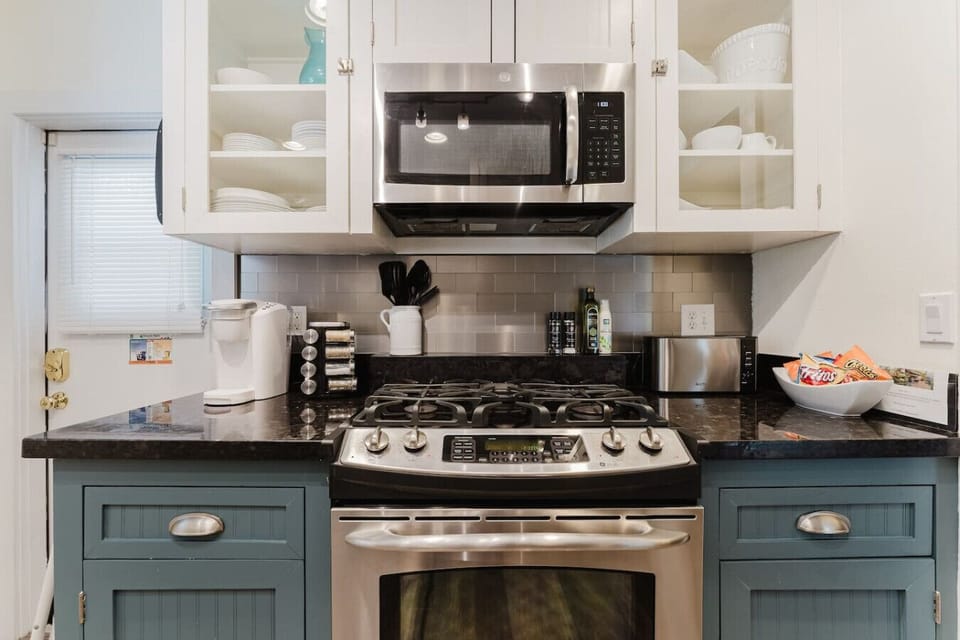 Cook with ease in this modern kitchen, equipped with stainless steel appliances, a gas stove, and all the cookware you need for a comfortable stay.Cook with ease in this modern kitchen, equipped with stainless steel appliances, a gas stove, and all the co