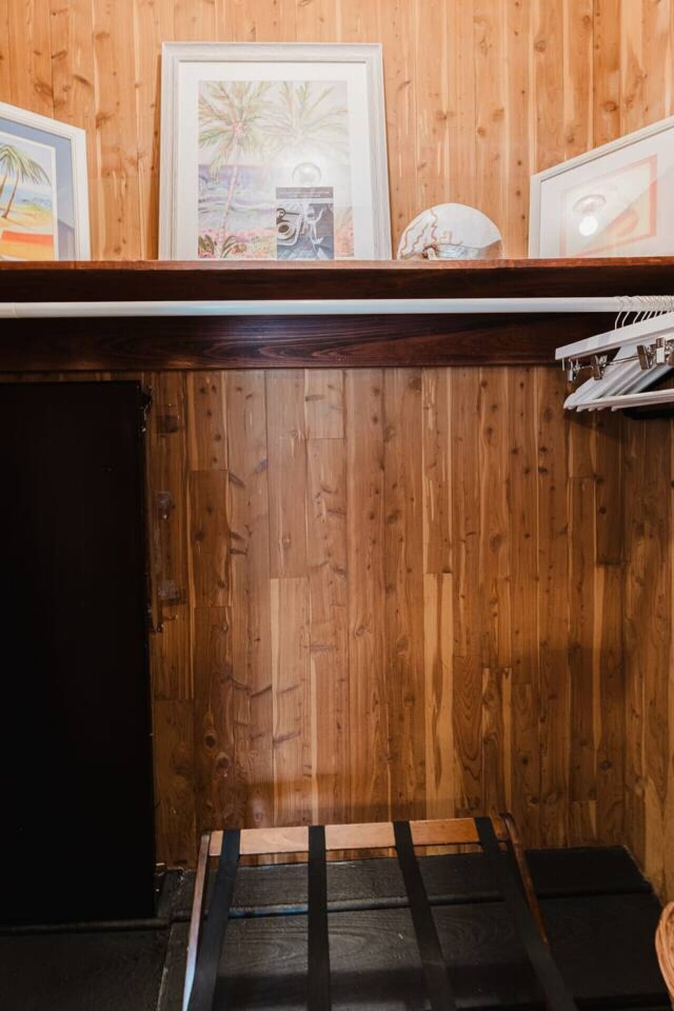 This wooden-accented closet offers ample space and sturdy hangers to keep your belongings organized during your stay.