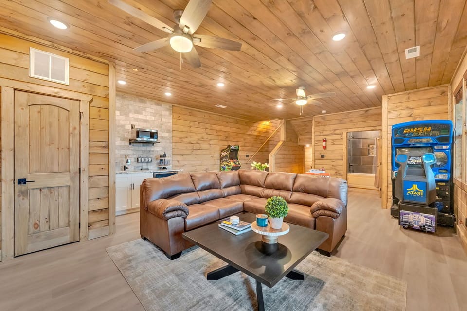 Spacious living room with cozy seating and mountain charm!