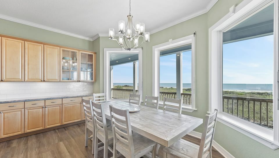 Gather around our large dining table with beach views - perfect for memorable family meals and game nights.