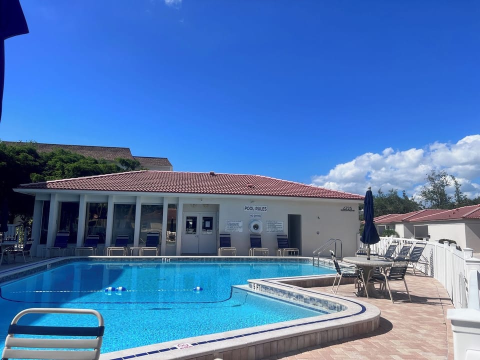 Community heated pool, with clubhouse, bathrooms, showers, BBQ grills and seats