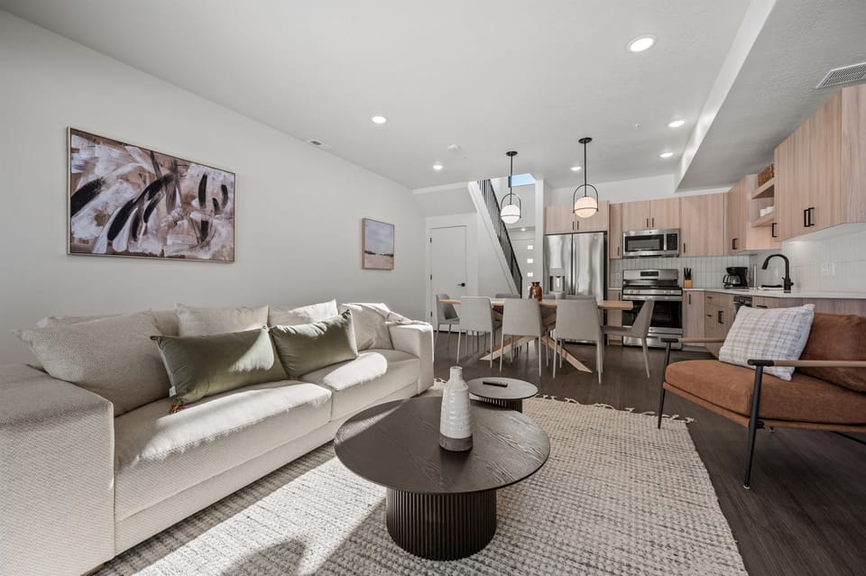 The open-concept living space, complete with a dining area, facilitates effortless conversation with family and friends.