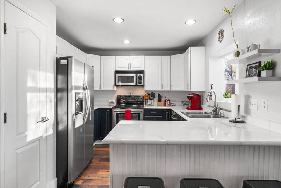 This kitchen is fully stocked with stainless steel appliances and plenty of space to cook a perfect meal