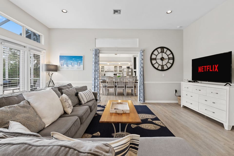 Relax in comfort on the large plush sofa, while enjoying your favorite shows on the 55" smart TV.