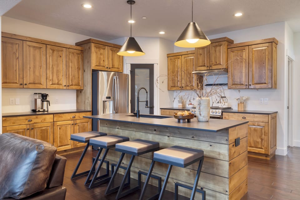 Fully equipped kitchen with barstool seating.