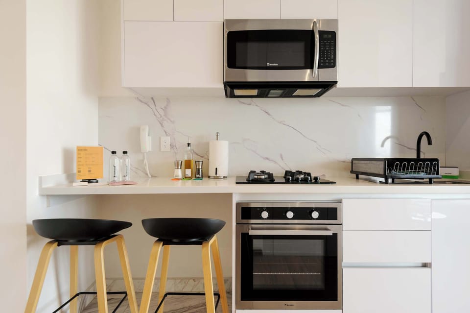 Fully equipped kitchen with modern appliances and a stylish breakfast bar.
