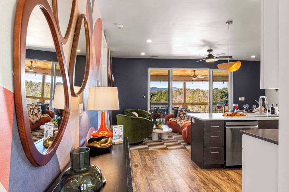 From the moment you step inside, you're greeted with breathtaking mountain views that instantly set the tone for your getaway. The entryway flows seamlessly into the heart of the home, where comfort and scenery come together.