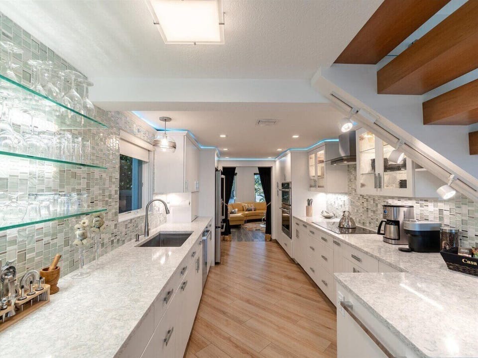 Sleek countertops, premium appliances, and ample storage make cooking a joy.