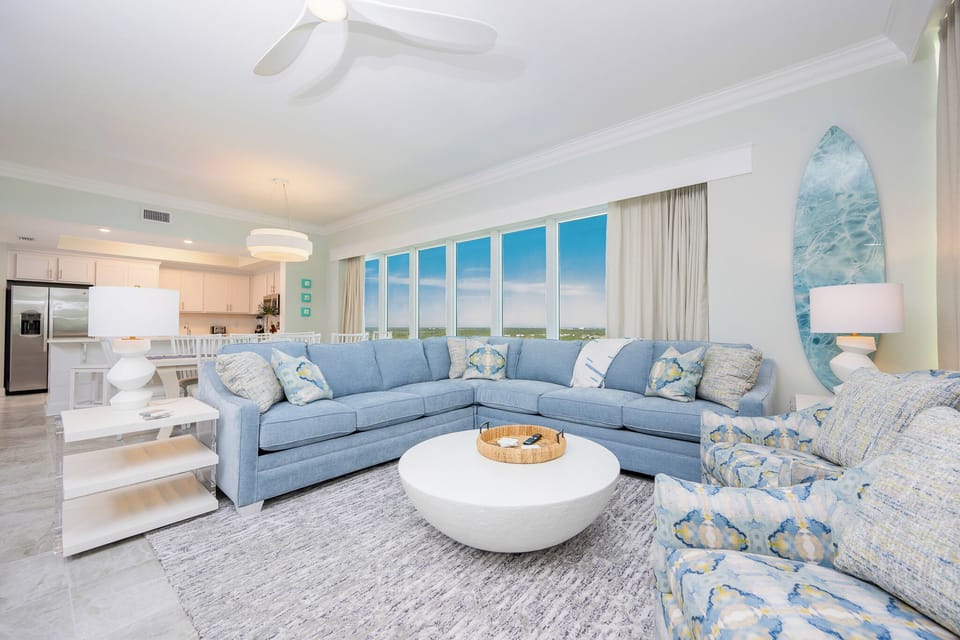 Relax on the sectional and admire and elegant coastal accents and stylish decor in your beachfront rental