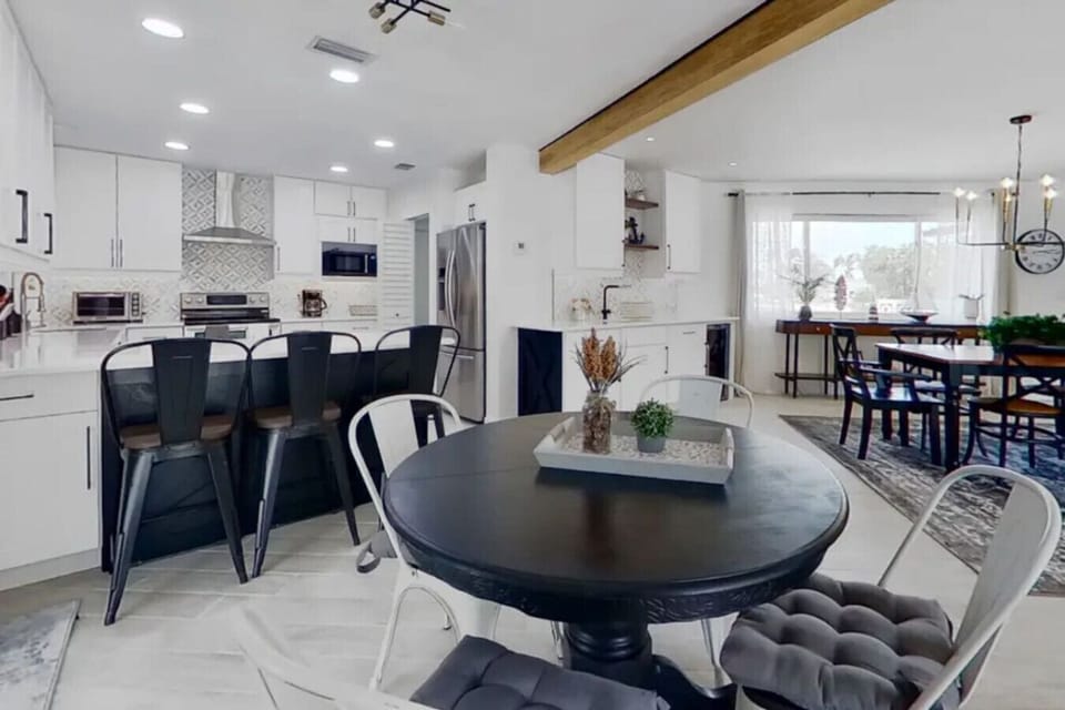 Kitchen with large Quartz island and bar stools