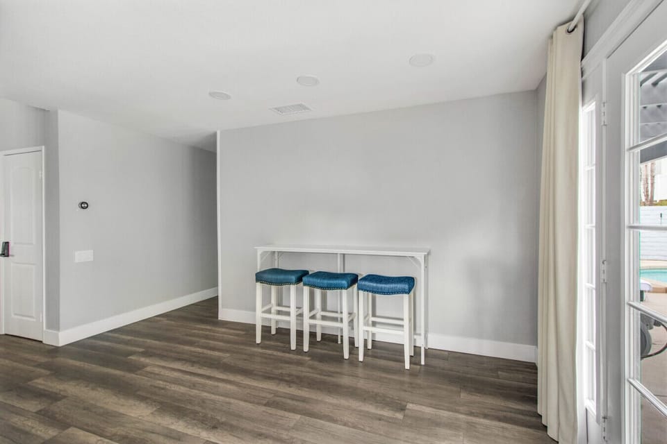 Step out from the breakfast nook directly to the pool area