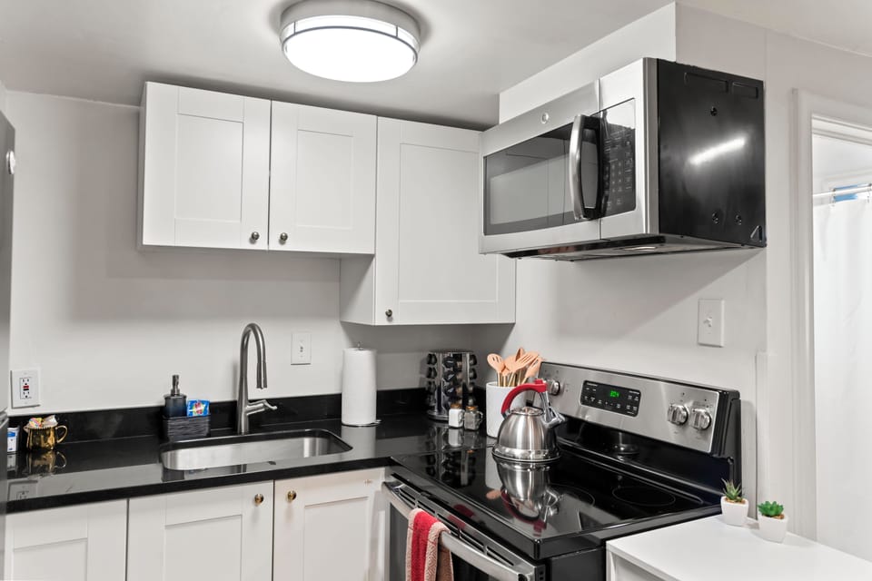Full kitchen with all of your cooking essentials. Microwave, oven & tea kettle.